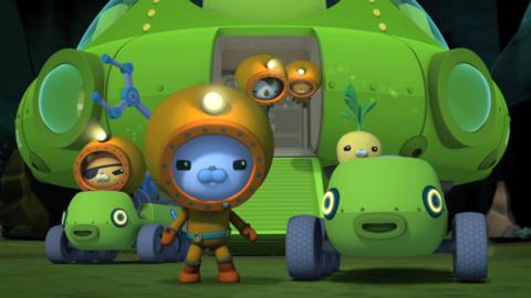 The Octonauts standing by the Octolab.