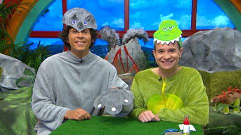 Andy and Alex in dinosaur costumes.