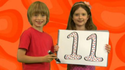 Two children holding a notepad