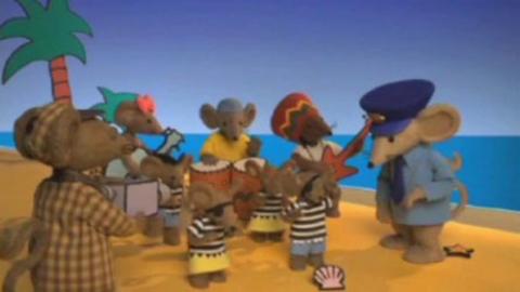 The Rastamouse characters on a beach