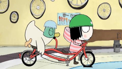 Sarah and Duck on a tandem bicycle