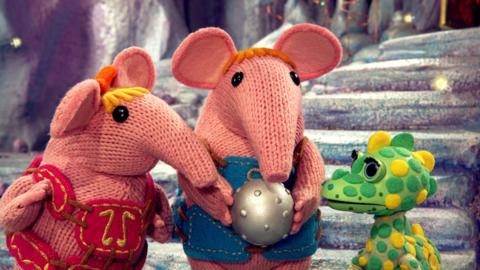 Small and Tiny Clanger holding a shiny, studded ball next to Baby Soup Dragon.