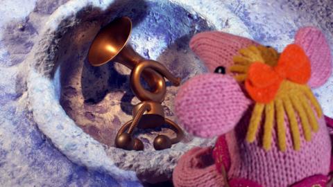 iny Clanger from The Clangers standing over a Hoot in a crater.