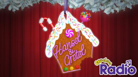 A gingerbread house with Hansel and Gretel written on it with icing.