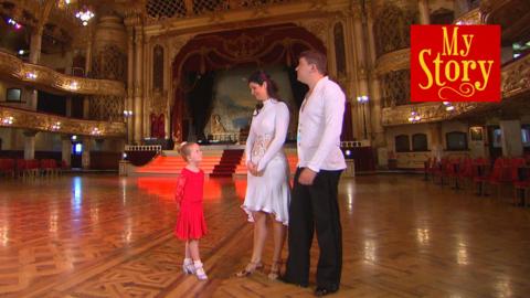 Darcy and her parents in a huge ballroom, with the My Story logo.