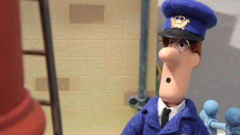 Pat from Postman Pat: Special Delivery Service looking surprised in front of a ladder.