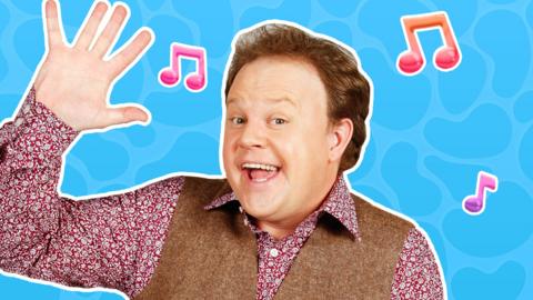 Justin Fletcher from Justin's Saturday Show waving.