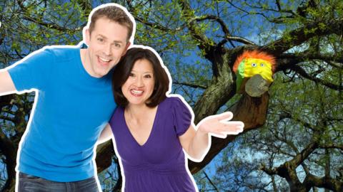 Stuffy from Show Me Show Me sitting in a tree with Chris and Pui standing below.