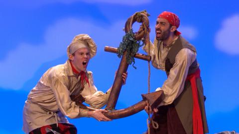 Cook and Line from Swashbuckle carrying a heavy anchor