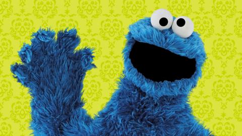 Cookie Monster waving.