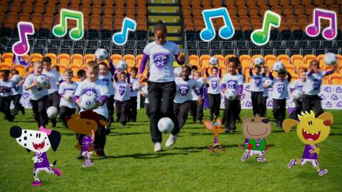 Rachel and the footy pups kicking footballs