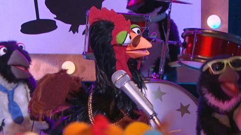 Chick Swagger singing on stage in The Furchester Hotel.