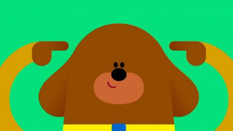 Duggee pointing to his head.