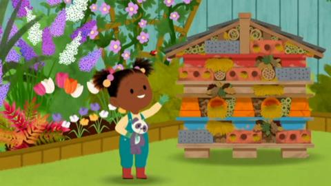 Illustration showing JoJo standing next to a Bug Hotel made from recycled items like old bricks and plant pots.