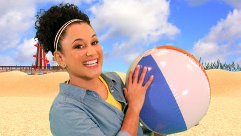 Cat holding a beach ball.