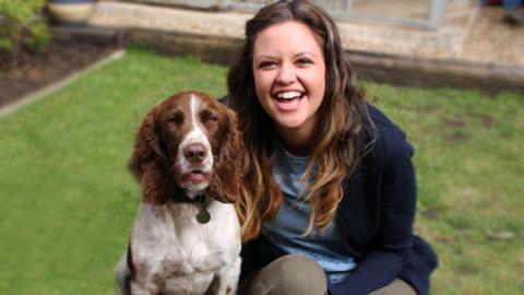 Ferne with a cocker spaniel dog