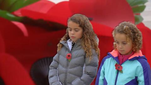 Alicia and her sister remember the fallen on Remembrance Day.