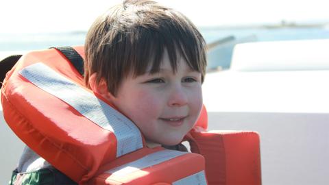 Adam on a boat ride