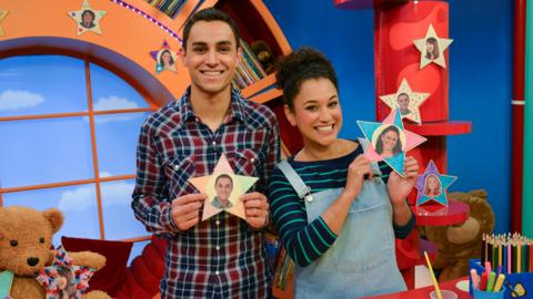 Ben and Cat holding their star selfies.