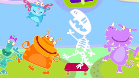 The school or roars dancing with a boney monster.