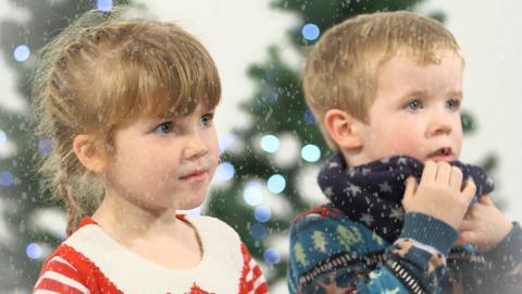 Kids singing Christmas songs.