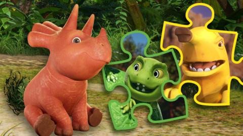 Ginger, a dinosaurs character is sitting in the jungle, there are two jigsaw pieces next to her. One has a pea-rex, and one has a bananaraptor character within the jigsaw piece.