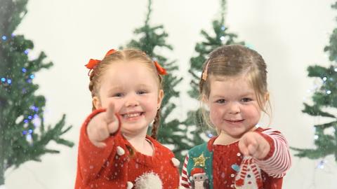 Kids singing Christmas songs.