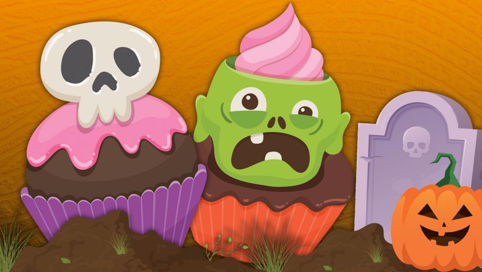 There is a cupcake with a skull and a zombie next to a pumpkin and a gravestone