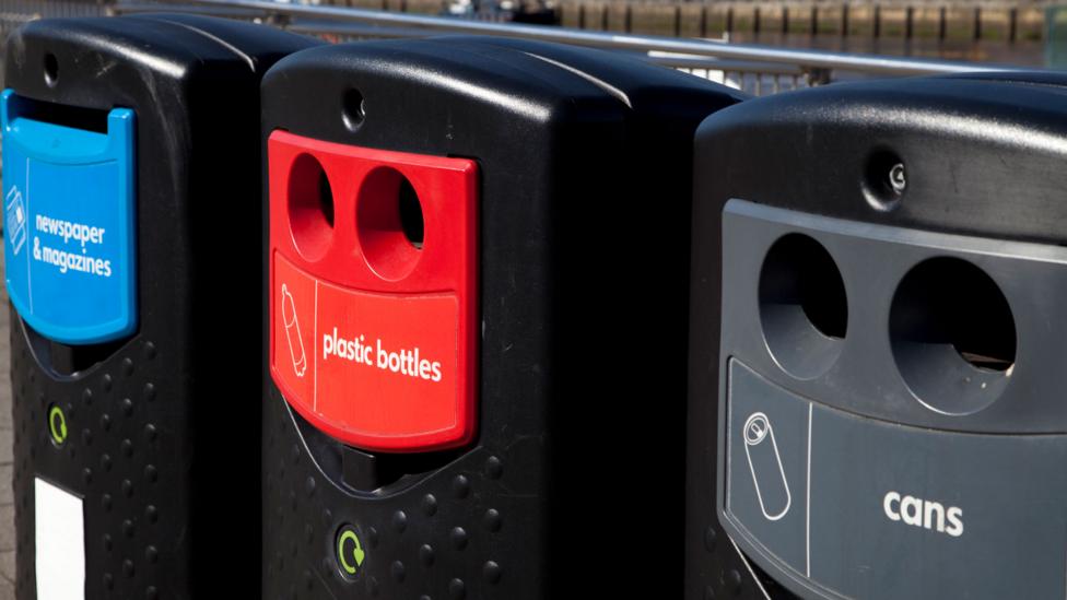 Three recycling bins.