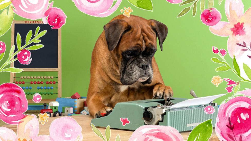 A dog sitting at a typewriter.