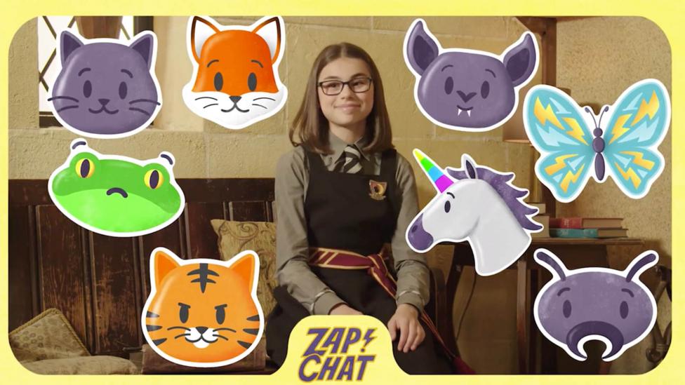 A young witch (Clarice) in Cackle's Academy uniform smiles, surrounded by animals.