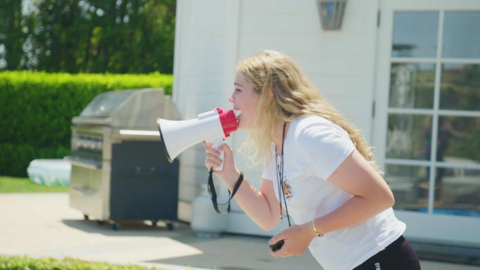 Tilly shouting with a megaphone