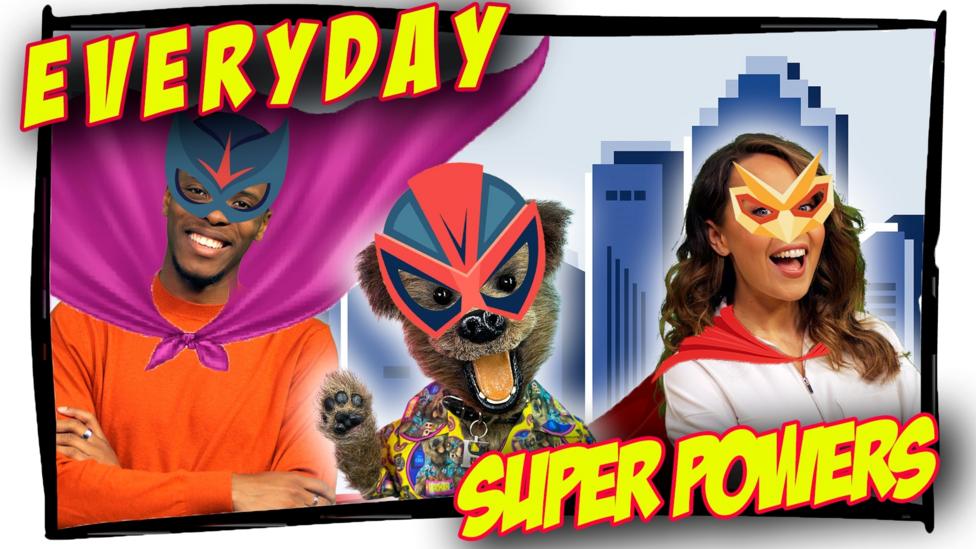 A man, a woman and a smiling dog are wearing superhero-style masks and capes in front of a city background. The text "Everyday Superpowers" is in front of them.