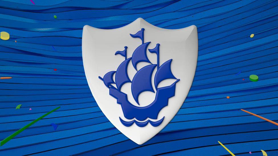 Blue Peter badge on blue background