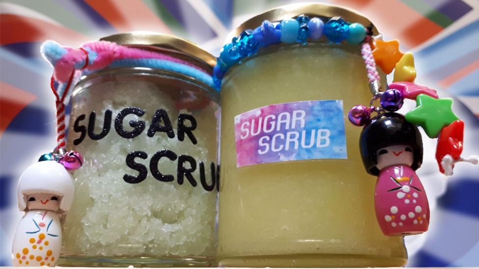 Two jars of sugar scrub in decorated jars.