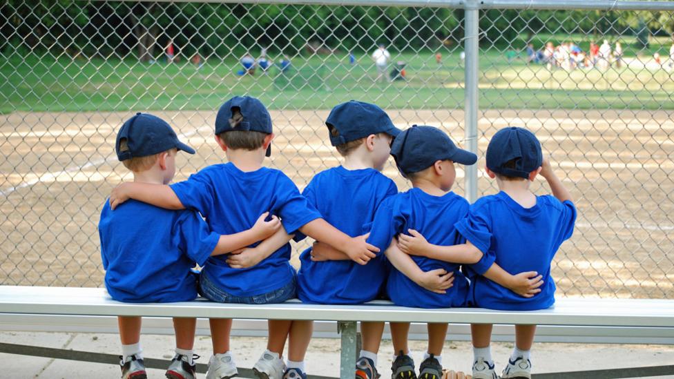 children with arms around each other