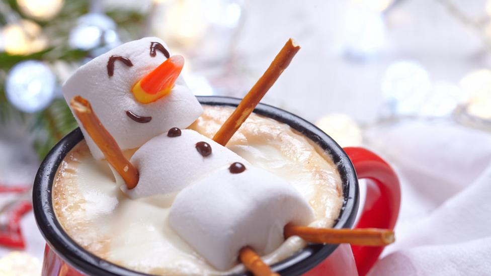 Snowman floating in hot chocolate