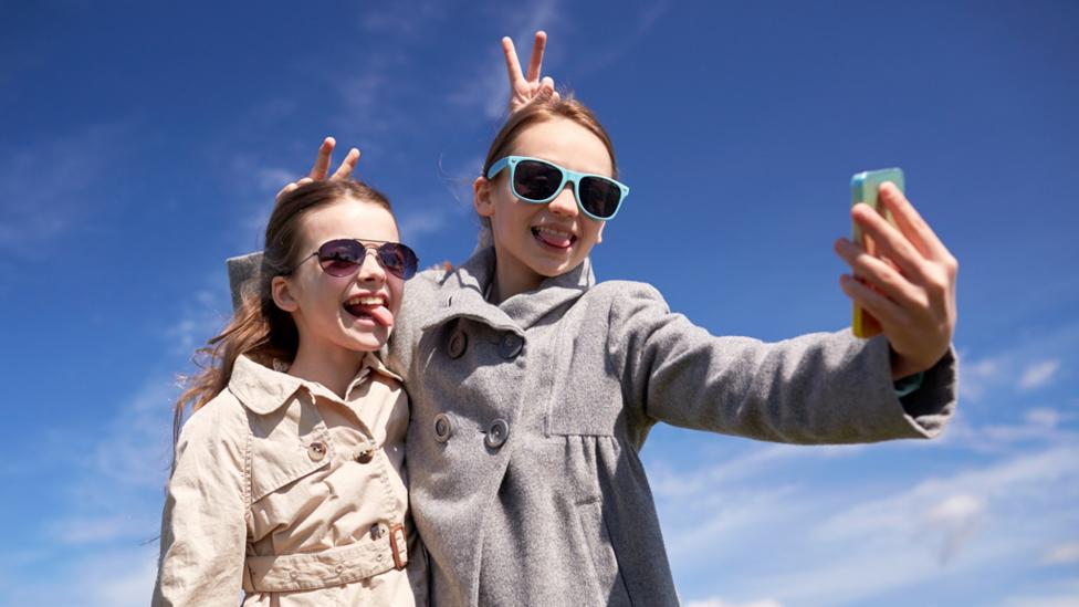 Friends taking a silly selfie