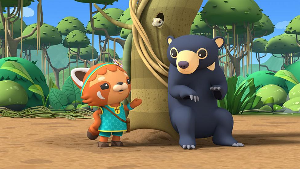 Octo-agent Min next to bear in the wild.