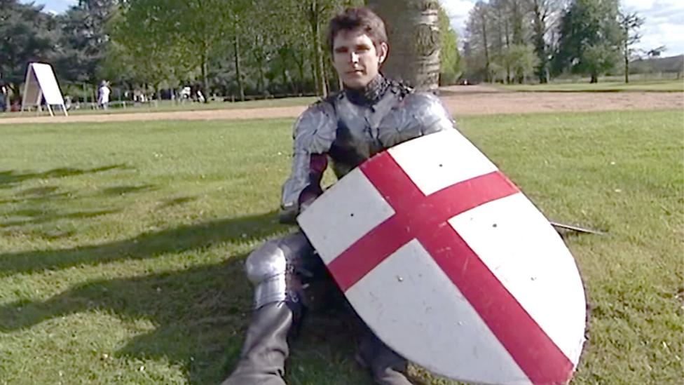 St George with shield.