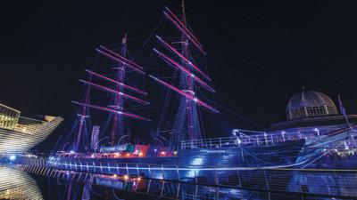 historic-ship-rrs-discovery-lit-up-at-night.