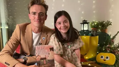 Tom Fletcher and Amazing Authors Competition winner Phoebe.
