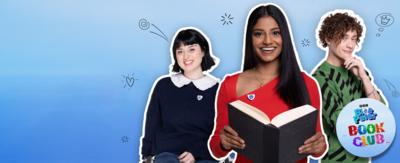 Blue Peter presenter Shini is holding a book and smiling. To her right is Joel and on her left is Abby. There is a small sticker in the corner that reads 'Blue Peter Book Club'.