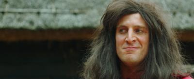 A middle-ages man with long hair.