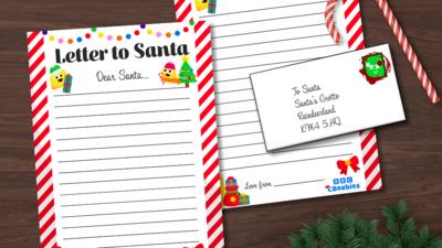 Two piece of lined paper, with Christmas images like presents and a Christmas tree are around the paper. Text reads Letter to Santa, Dear Santa. There is an envelope on top of the paper that is addressed to Santa.