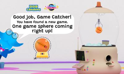 Mr Moustache is peeking from the side of the image with speech text that reads 'good job game catcher! You have found a new game. One game-sphere coming right up!'.There is a sphere below with a cut out line around it. The game machine is in the background picking up the same sphere.