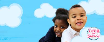 Two young children in their school uniform, they are smiling and against the Time For School sunny blue sky background.