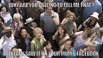 Group of people on phones looking up and smiling.