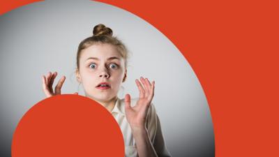 A young girl looks panicked with red circles around her