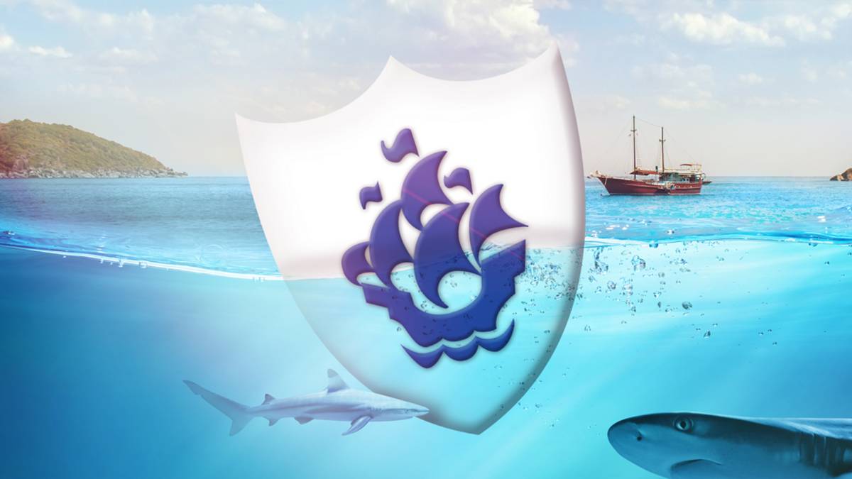 A giant Blue Peter badge in the sea with sharks and a ship.